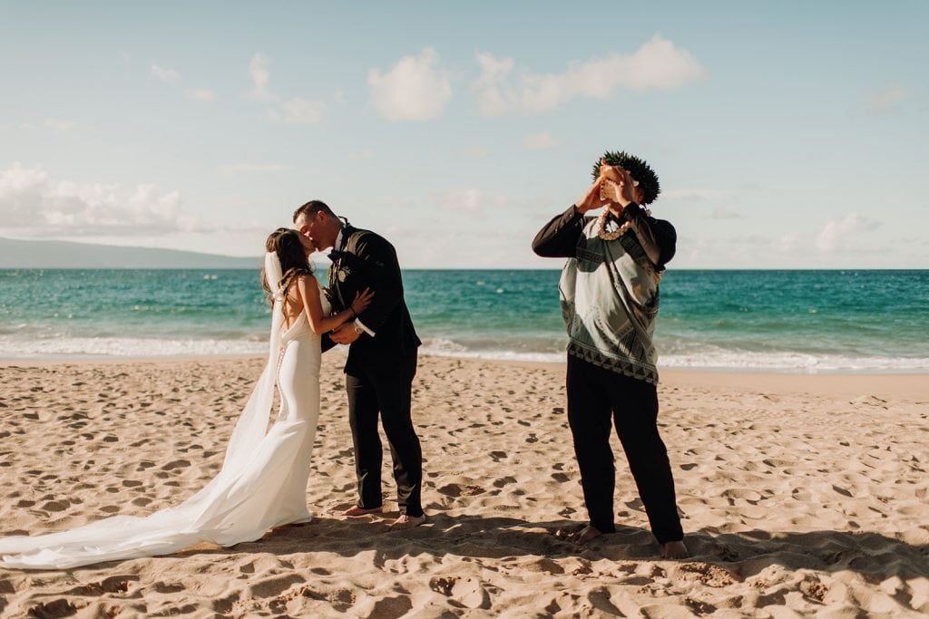 officiant blowing the conch shell