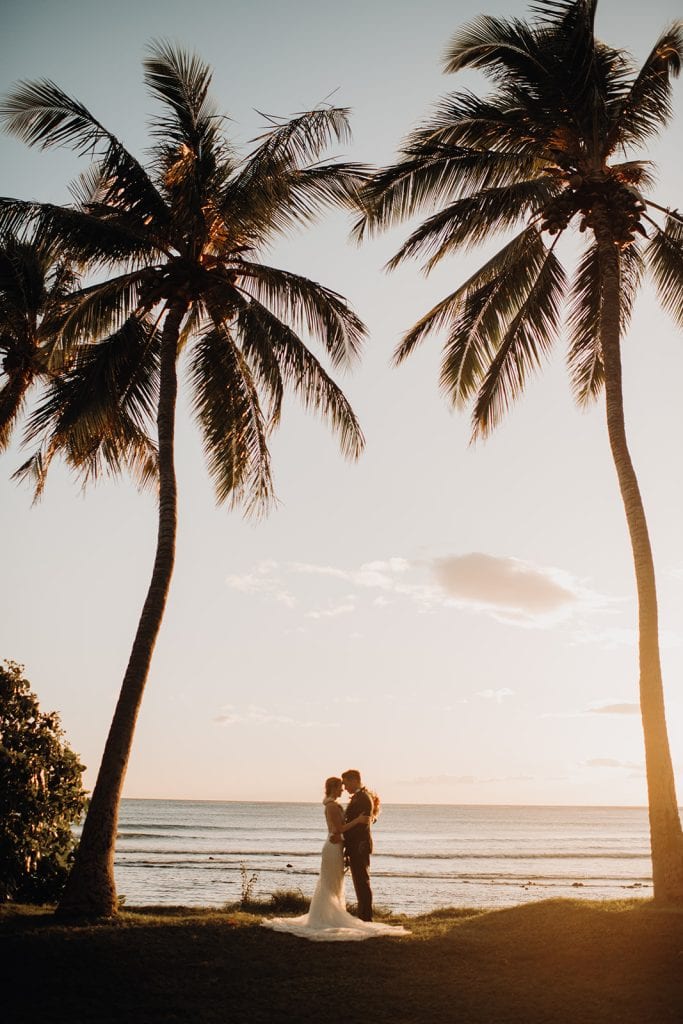 sweet couple walking on Maui beach 