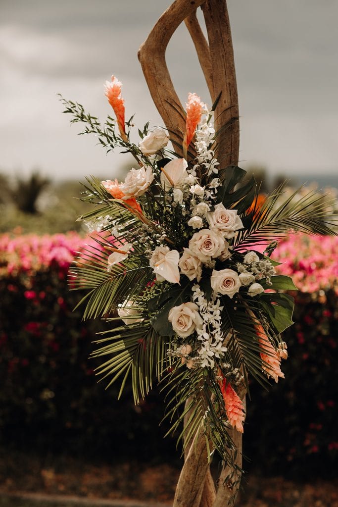 tropical wedding flowers on a wedding arch at Hotel Wailea
