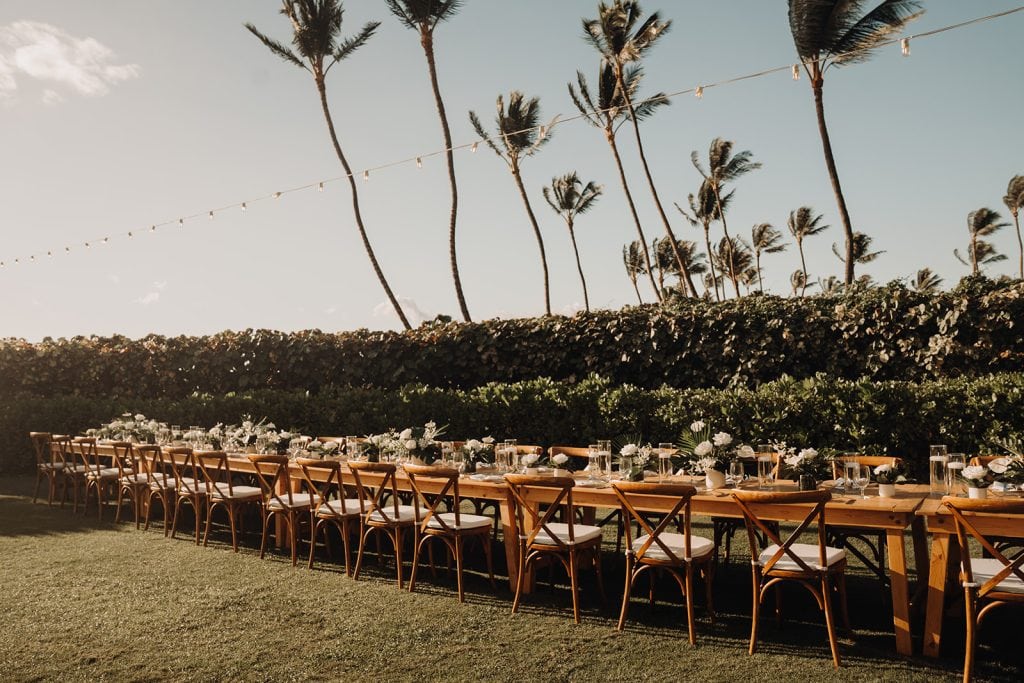A stylish and modern wedding setup at Andaz Maui Wailea, with vibrant floral arrangements and panoramic views of the Pacific.