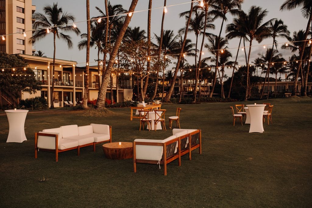 A stylish and modern wedding setup at Andaz Maui Wailea, with vibrant floral arrangements and panoramic views of the Pacific.
