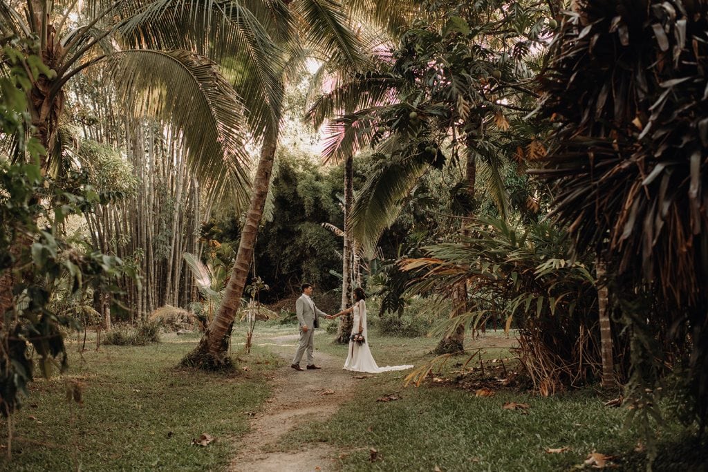 bride and groom in the Maui jungle