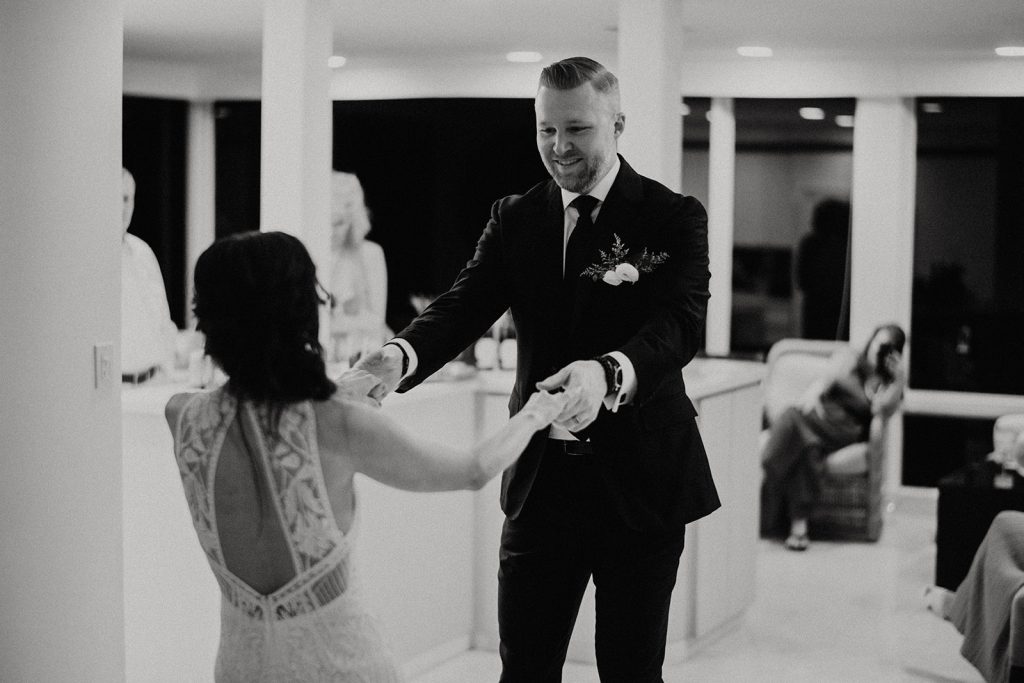 bride and groom dance together in their Kapalua Villa