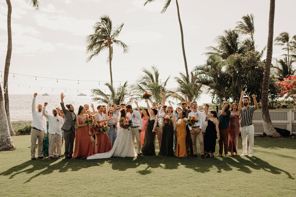 bride and groom surrounded by their friends and family